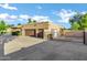 Large detached garage with multiple bays, gated drive, and ample parking space at 9 E Los Arboles Cir, Tempe, AZ 85284
