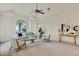 Bright living room with vaulted ceilings, a large window, comfortable seating, and neutral tones at 9 E Los Arboles Cir, Tempe, AZ 85284