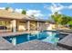 Beautiful backyard pool with a patio perfect for relaxing or entertaining guests at 9 E Los Arboles Cir, Tempe, AZ 85284