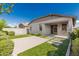 Charming backyard featuring a covered patio and a serene, low-maintenance desert landscape at 9822 W Caron Dr, Peoria, AZ 85345