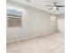 Large bedroom featuring soft carpet, a ceiling fan, and multiple windows for natural light at 9822 W Caron Dr, Peoria, AZ 85345