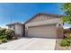 Attractive single-Gathering home featuring a two-car garage and low-maintenance desert landscaping at 9822 W Caron Dr, Peoria, AZ 85345