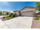 Inviting single-Gathering home with a two-car garage and low-maintenance desert landscaping at 9822 W Caron Dr, Peoria, AZ 85345