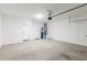Spacious three car garage with epoxy floors and ample room for storage at 9822 W Caron Dr, Peoria, AZ 85345