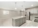 Eat-in kitchen featuring a large center island and stainless steel appliances at 9822 W Caron Dr, Peoria, AZ 85345
