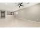 Open living room with tile flooring, neutral walls, and a view to the home's entrance at 9822 W Caron Dr, Peoria, AZ 85345
