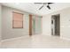 Living room with a sliding glass door to the back yard and an entrance to another room at 9822 W Caron Dr, Peoria, AZ 85345