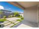 Covered patio with brick paver designs and a beautifully landscaped backyard at 9822 W Caron Dr, Peoria, AZ 85345