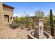 Outdoor balcony with decorative fountain and wrought iron railing with views of desert landscape at 10511 E Skinner Dr, Scottsdale, AZ 85262