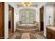 Luxurious bathroom with a standalone soaking tub, dual entrances, and decorative lighting at 10511 E Skinner Dr, Scottsdale, AZ 85262