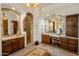 Spacious bathroom featuring dual vanities, a tiled shower, and a separate makeup area at 10511 E Skinner Dr, Scottsdale, AZ 85262