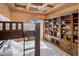 This bedroom features a bunk bed, a ceiling fan, and a large built-in bookcase at 10511 E Skinner Dr, Scottsdale, AZ 85262