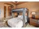 Cozy bedroom boasts a sturdy bunk bed alongside a wooden dresser and textured orange walls at 10511 E Skinner Dr, Scottsdale, AZ 85262