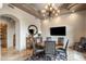 Traditional dining room with a chandelier, wooden table, and seating for six, with custom ceiling at 10511 E Skinner Dr, Scottsdale, AZ 85262