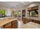 Bright and spacious kitchen with granite countertops, an island with bar seating, and stainless steel appliances at 10511 E Skinner Dr, Scottsdale, AZ 85262