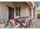 Covered patio features an outdoor dining area with comfortable seating and desert views at 10511 E Skinner Dr, Scottsdale, AZ 85262