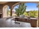 Built-in outdoor kitchen equipped with a grill and counter seating, perfect for entertaining at 10511 E Skinner Dr, Scottsdale, AZ 85262