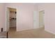 Bedroom with neutral walls, carpeted flooring, and a walk-in closet at 11142 E Ravenna Ave, Mesa, AZ 85212