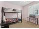 Bedroom features a bunk bed, TV, and carpeted flooring at 11142 E Ravenna Ave, Mesa, AZ 85212