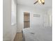 Bedroom featuring carpeted floor, ceiling fan, and walk-in closet at 11142 E Ravenna Ave, Mesa, AZ 85212