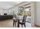 Bright dining area with direct access and view of the backyard pool through sliding glass doors at 11142 E Ravenna Ave, Mesa, AZ 85212