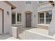 Welcoming front entrance with a gated courtyard and charming architectural details at 11142 E Ravenna Ave, Mesa, AZ 85212
