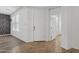 Bright foyer with tile and wood flooring, offering a view to rooms beyond at 11142 E Ravenna Ave, Mesa, AZ 85212