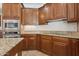 Close up of Kitchen with granite countertops, stainless appliances, and custom wood cabinets at 11142 E Ravenna Ave, Mesa, AZ 85212