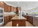 Modern kitchen features granite countertops, stainless steel appliances, and custom cabinets at 11142 E Ravenna Ave, Mesa, AZ 85212
