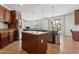 Open kitchen concept with modern appliances, eat-in island, and seamless flow to the living area at 11142 E Ravenna Ave, Mesa, AZ 85212