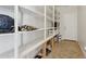 Spacious pantry with ample shelving, perfect for organized storage at 11142 E Ravenna Ave, Mesa, AZ 85212