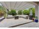 Patio featuring a large seating area, pergola, and desert landscaping at 11142 E Ravenna Ave, Mesa, AZ 85212