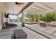 Inviting covered patio with outdoor seating, ceiling fans, and views of the pool and spa at 11142 E Ravenna Ave, Mesa, AZ 85212