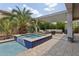 Backyard pool and jacuzzi with tiled border and outdoor seating area at 11142 E Ravenna Ave, Mesa, AZ 85212