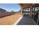 Backyard features large glass doors, concrete patio, and a blank canvas for landscaping at 11417 E Utah Ave, Mesa, AZ 85212