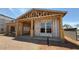 New construction showcasing the home's framing, window installation, and modern architectural design under a sunny sky at 11417 E Utah Ave, Mesa, AZ 85212