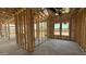 Framing reveals open layout, window placement, and room dimensions to illustrate potential of a customizable space at 11417 E Utah Ave, Mesa, AZ 85212