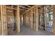 Framing displays open-concept design, emphasizing the layout and potential flow between rooms and natural light at 11417 E Utah Ave, Mesa, AZ 85212