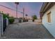 Large backyard featuring a gravel landscape and cinder block fence for added privacy at 1258 E Campus Dr, Tempe, AZ 85282