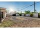 Large backyard features a gravel groundcover and is enclosed by a cinder block fence at 1258 E Campus Dr, Tempe, AZ 85282