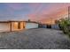 Backyard featuring a low-maintenance gravel landscape, enclosed by a block fence for added privacy and security at 1258 E Campus Dr, Tempe, AZ 85282
