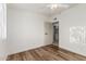 Bedroom featuring wood flooring, neutral walls, natural light, creating a comfortable and inviting space at 1258 E Campus Dr, Tempe, AZ 85282