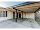 Attached covered parking area with multiple entry doors provides secure and convenient access to the home at 1258 E Campus Dr, Tempe, AZ 85282