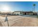 Single-story home features desert landscaping and a convenient covered parking area at 1258 E Campus Dr, Tempe, AZ 85282