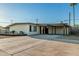 Single-story home features desert landscaping, painted in neutral colors, and a convenient covered parking area at 1258 E Campus Dr, Tempe, AZ 85282