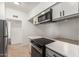 Efficient kitchen layout featuring modern appliances and ample cabinet space, perfect for cooking and storage at 1258 E Campus Dr, Tempe, AZ 85282