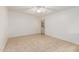 Light-filled room with tile flooring, a ceiling fan, and an exterior door at 1258 E Campus Dr, Tempe, AZ 85282