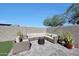 The backyard patio offers a comfortable seating area and a fire pit at 13487 W Buckskin Trl, Peoria, AZ 85383