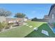 Beautiful backyard with a seating area and artificial grass at 13487 W Buckskin Trl, Peoria, AZ 85383