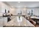 Well-lit kitchen showcasing granite counters, stainless steel appliances, and ample cabinet space at 13487 W Buckskin Trl, Peoria, AZ 85383
